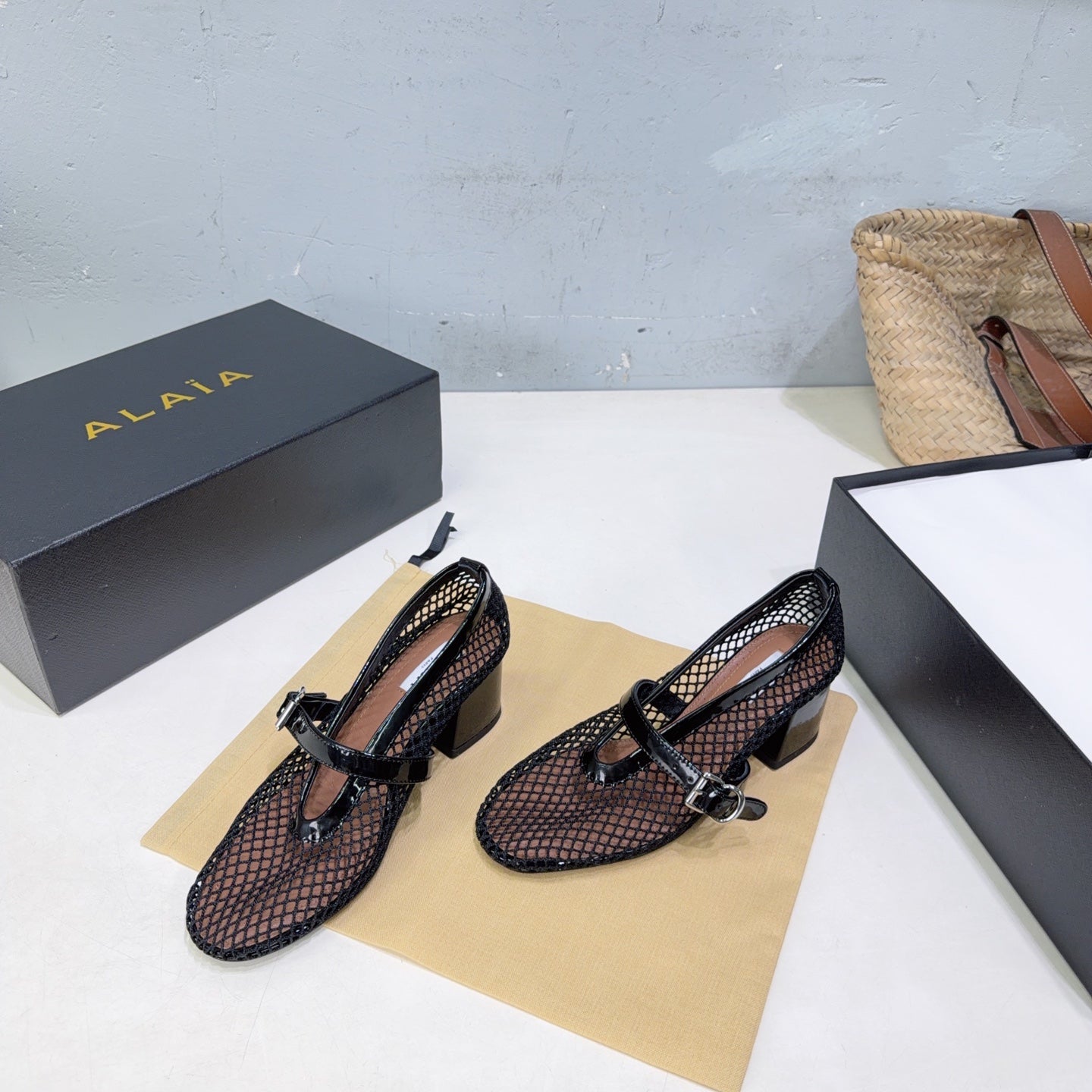 ALAIA 26S HIGH-HEEL MARY JANES 50 MM IN BLACK WOVEN MESH