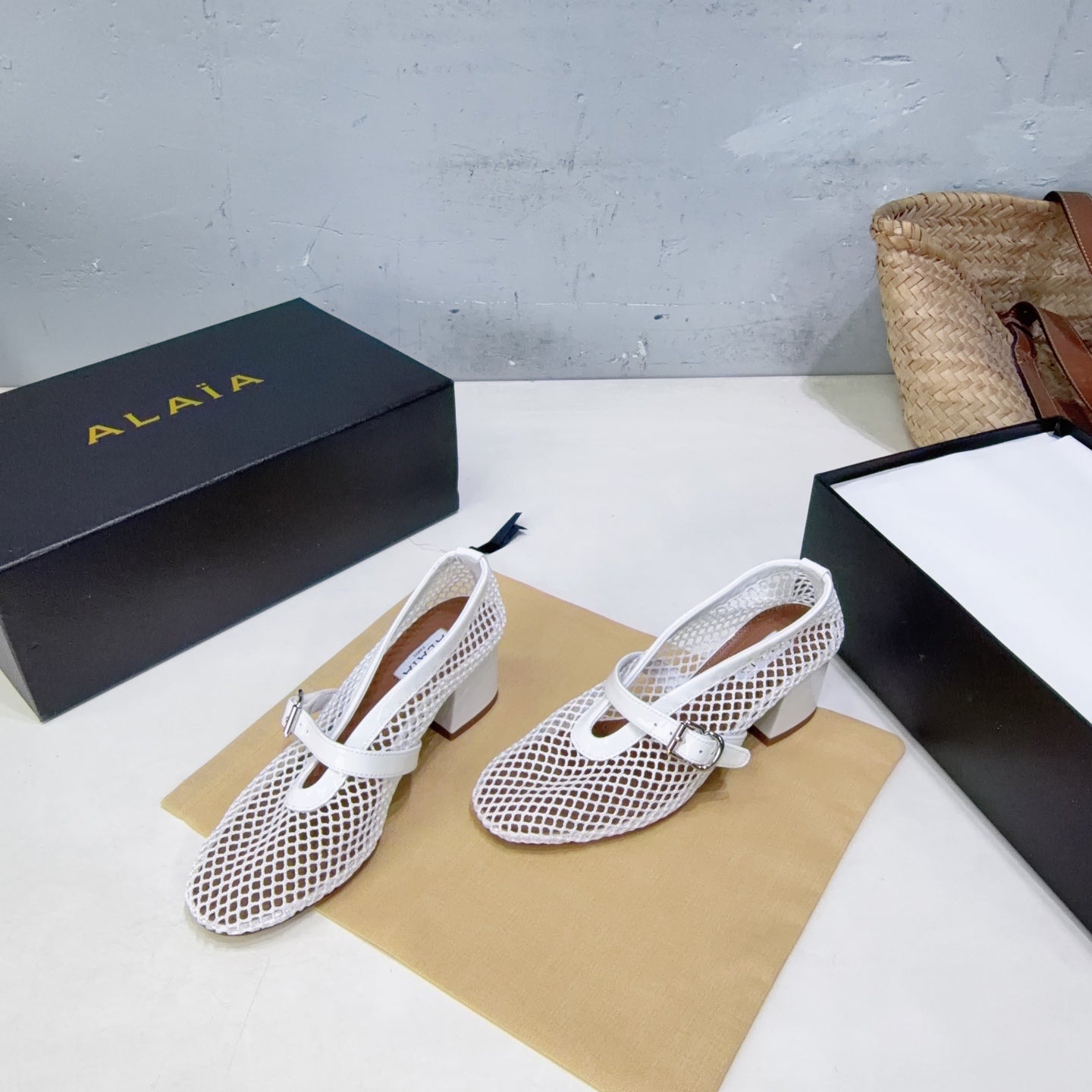 ALAIA 26S HIGH-HEEL MARY JANES 50 MM IN WHITE WOVEN MESH