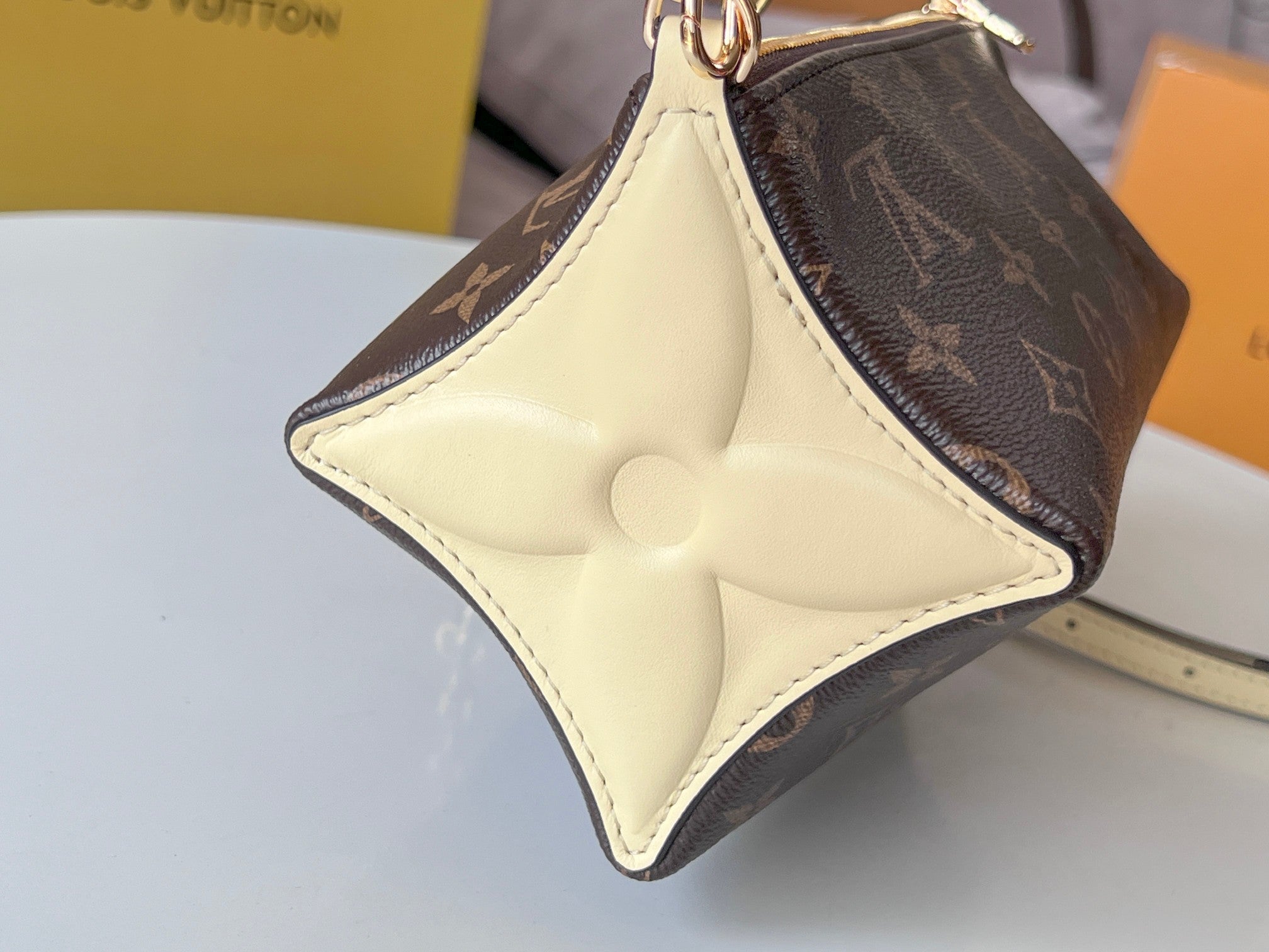 BLOOM POUCH 22 IN BROWN MONOGRAM CANVAS AND PASTEL YELLOW CALFSKIN SIDES