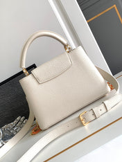 CAPUCINES BB 27 IN PEARL WHITE TAURILLON GOLD HARDWARE