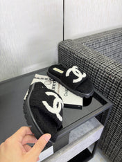 CHANEL 26S SLIDE SANDALS  IN BLACK AND WHITE SHEARLING OPEN TOE