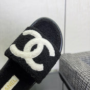 CHANEL 26S SLIDE SANDALS  IN BLACK AND WHITE SHEARLING OPEN TOE