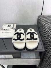 CHANEL 26S SLIDE SANDALS  IN BLACK AND WHITE SHEARLING