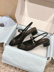 PRADA 26S SLINGBACK SANDALS 40MM IN BLACK CALFSKIN WITH LOGO