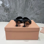 HIGH - HEEL BLACK SHEEPSKIN WITH STYLIZED STRAPS