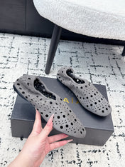 ALAIA 26S FLAT SLIP-ONS IN GREY SUEDE WITH OPENWORK PATTERN