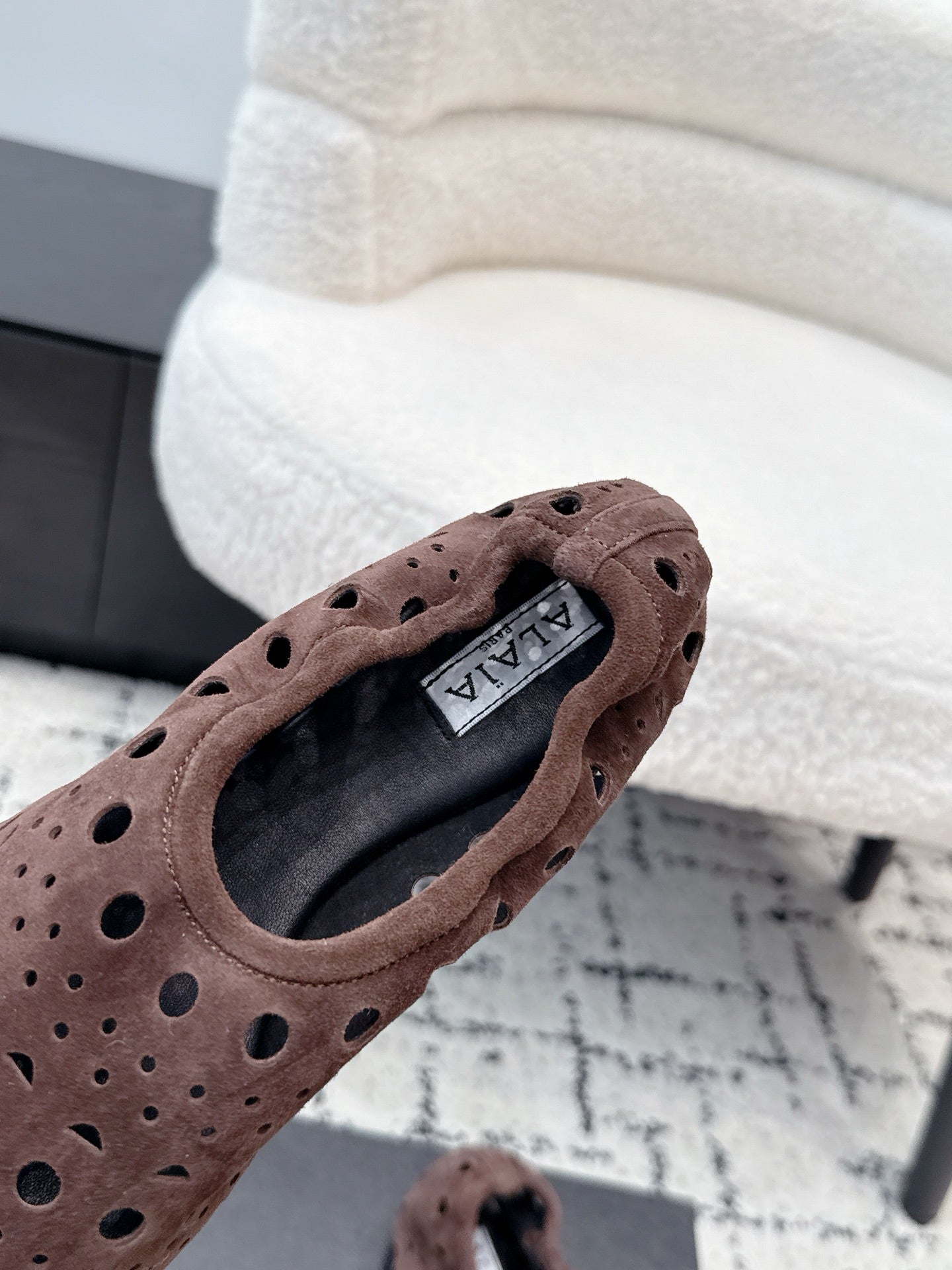 ALAIA 26S FLAT SLIP-ONS IN DARK BROWN SUEDE WITH OPENWORK PATTERN