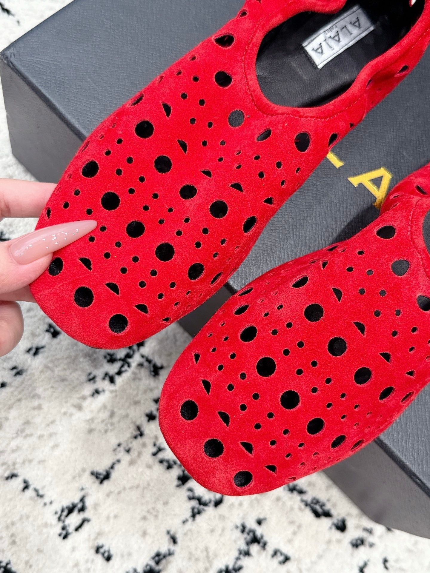 ALAIA 26S FLAT SLIP-ONS IN RED SUEDE WITH OPENWORK PATTERN