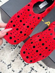 ALAIA 26S FLAT SLIP-ONS IN RED SUEDE WITH OPENWORK PATTERN