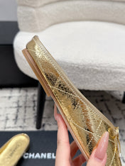 CHANEL 26S FLAT MULES IN GOLD LAMBSKIN