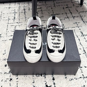 CHANEL 26S LACE-UP SNEAKERS IN WHITE AND BLACK SUEDE STYLE 2