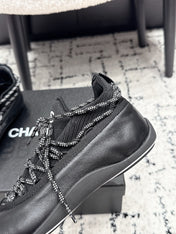 CHANEL 26S LACE-UP SNEAKERS IN BLACK FABRIC AND LAMBSKIN