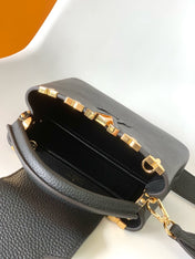 CAPUCINES MM BAG 21 IN BLACK TAURILLON COWHIDE GOLD HARDWARE