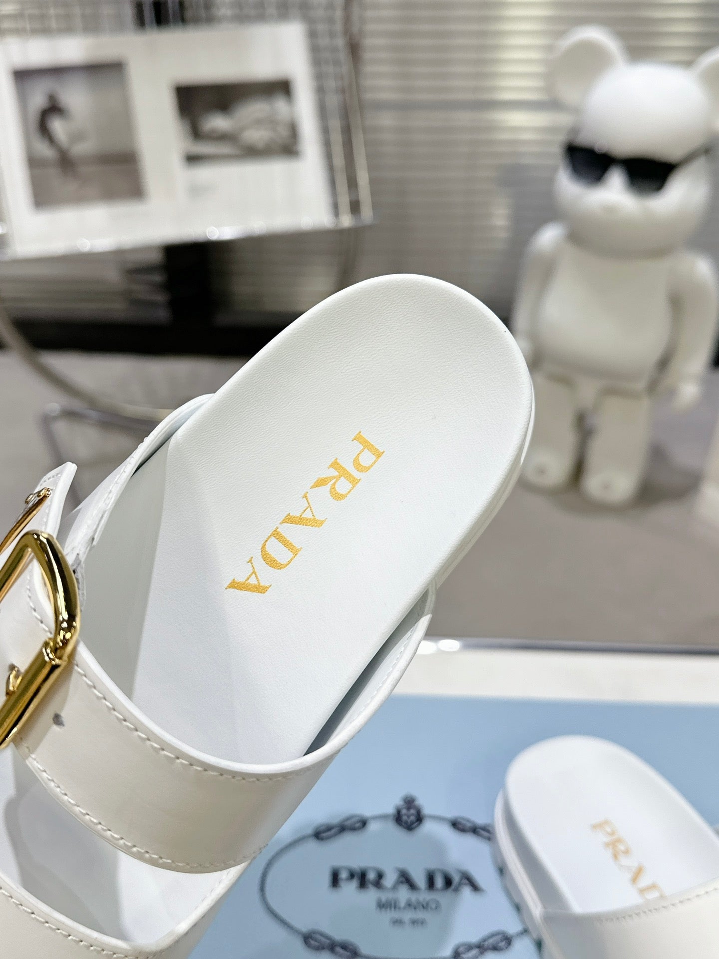 PRADA 25S STRAP SLIDES 30MM IN WHITE CALFSKIN GOLD HARDWARE