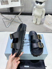 PRADA 25S STRAP SLIDES 30MM IN BLACK CALFSKIN GOLD HARDWARE
