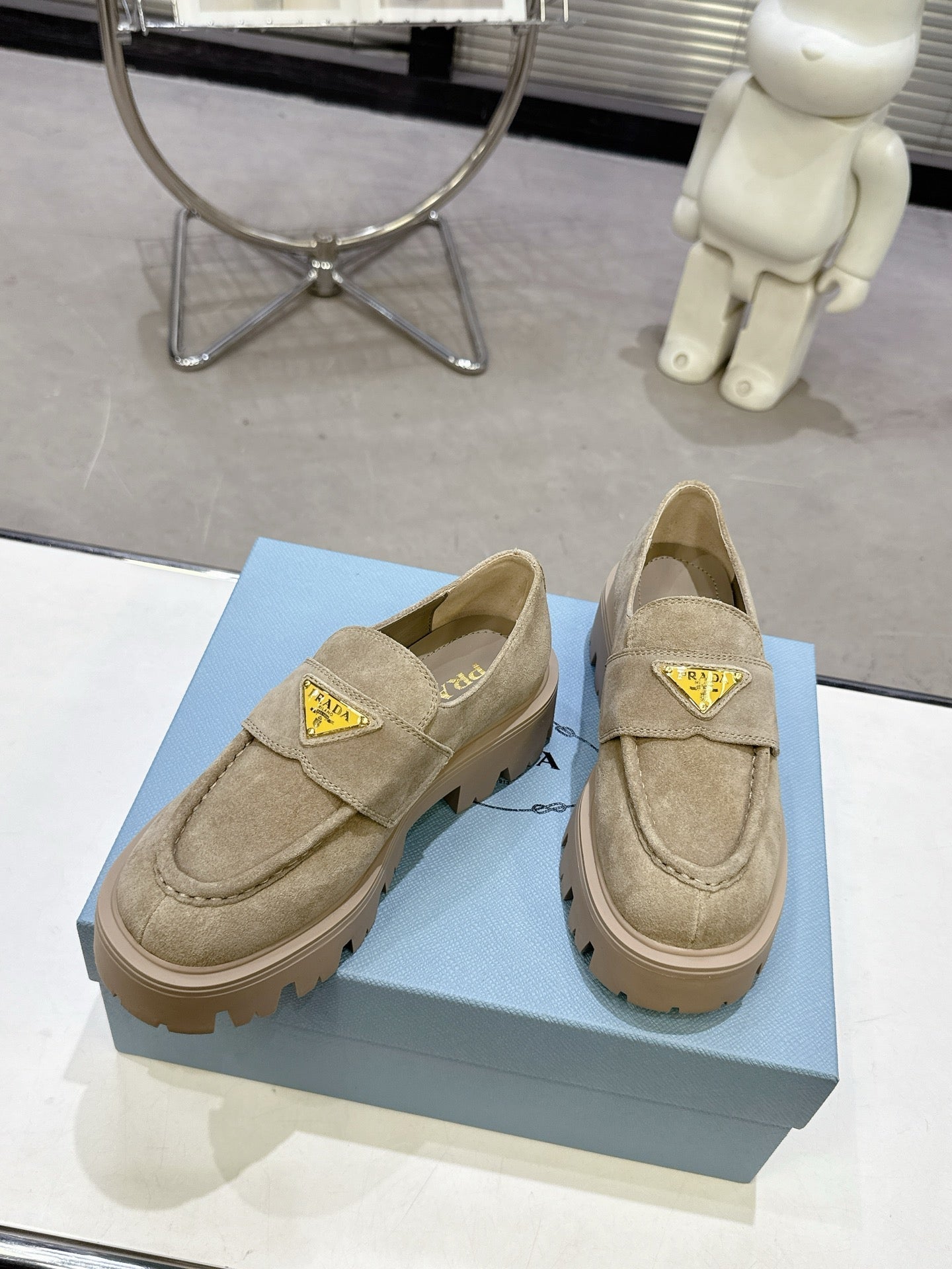 PRADA 25S THICK-SOLE LOAFERS 60 MM IN BEIGE SUEDE WITH GOLD HARDWARE