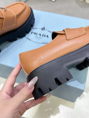 PRADA 25S THICK-SOLE LOAFERS 60 MM IN COGNAC BROWN CALFSKIN