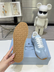 PRADA 26S LACE UP SNEAKERS IN LIGHT BLUE NYLON AND SUEDE
