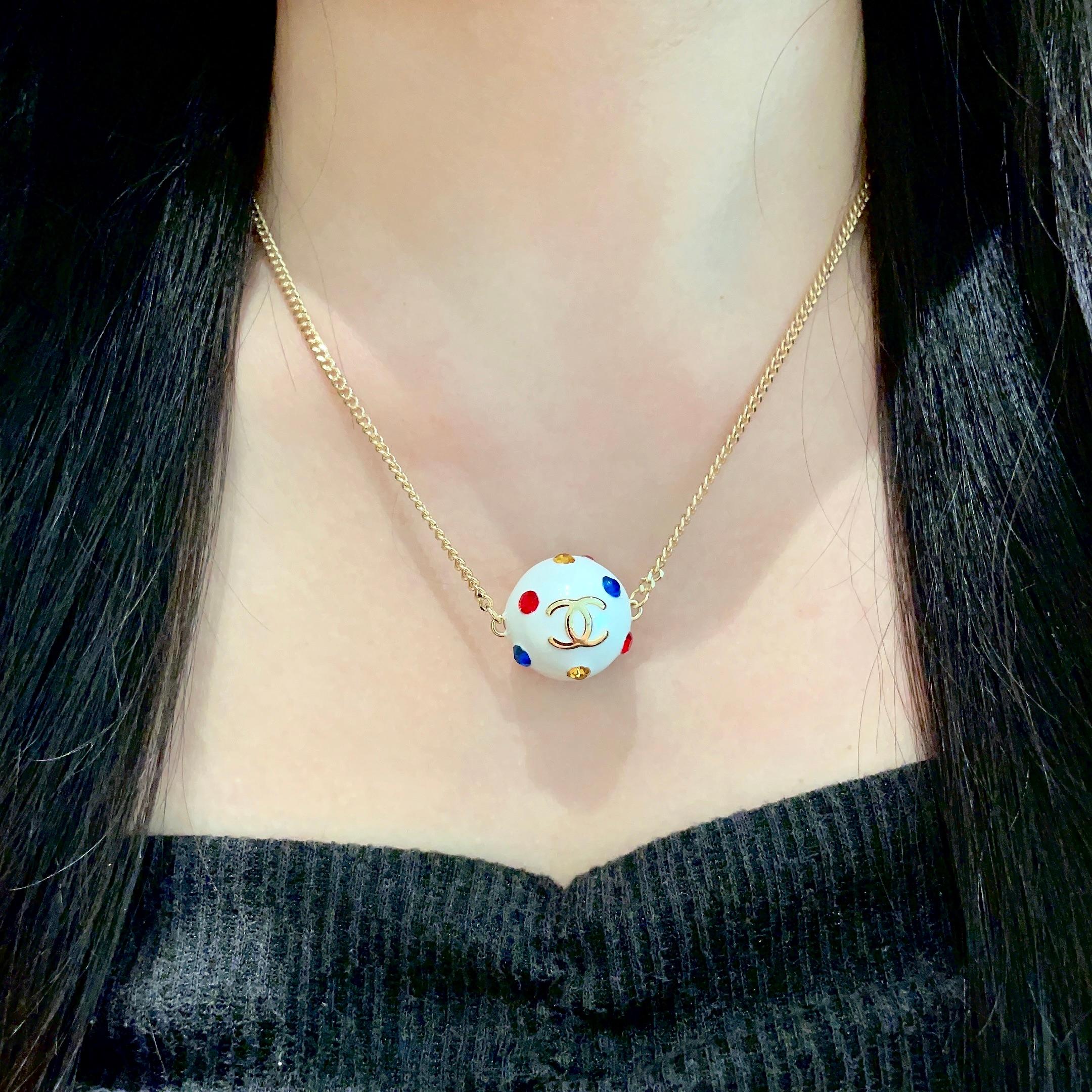 CHANEL 26S DOUBLE C LOGO WHITE ENAMEL CRYSTAL BALL PENDANT NECKLACE IN GOLD METAL 629889