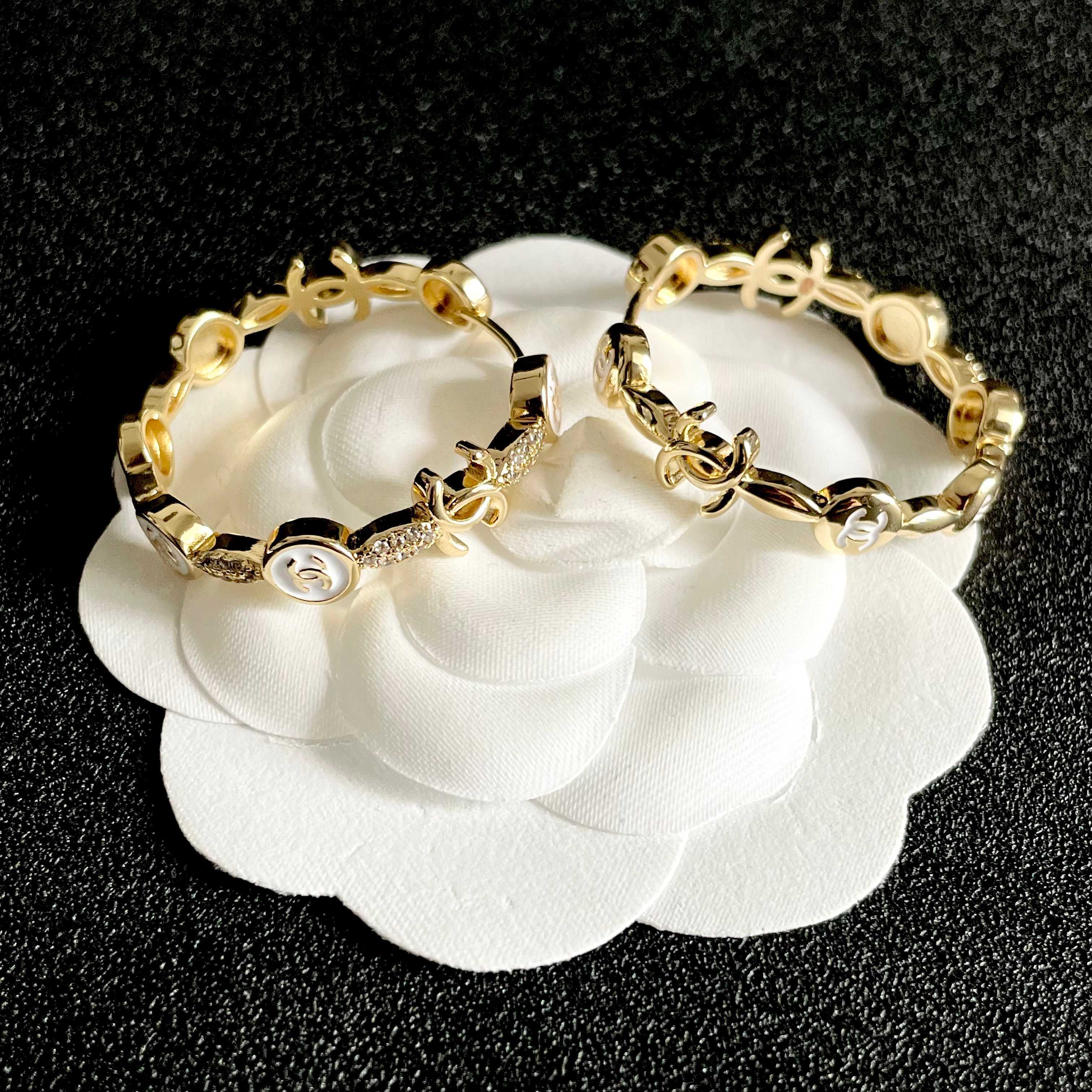 CHANEL 26S DOUBLE C LOGO WHITE ENAMEL & CRYSTAL LINK HOOP EARRINGS IN GOLD METAL 629898