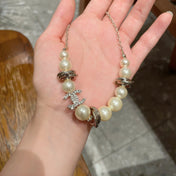 CHANEL 26S DOUBLE C LOGO PEARL BEADED BRACELET WITH CRYSTAL DETAIL IN GOLD METAL 631014