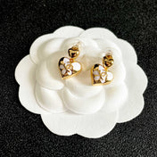 CHANEL 26S DOUBLE C HEART DROP EARRINGS WITH WHITE ENAMEL FLORAL DETAIL IN GOLD METAL 631910