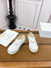 DIOR 26S LOW TOP SNEAKERS IN WHITE CANVAS WITH FLORAL EMBROIDERY