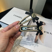 CHANEL 26S BOW HAIR CLIP IN BLACK FABRIC 505310