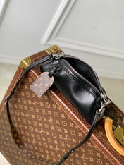 POCHETTE VIBE HANDBAG 25 IN BLACK LAMBSKIN BROWN COWHIDE AND COATED CANVAS TRIM