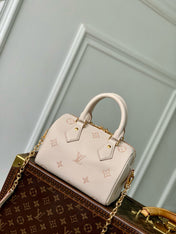 SPEEDY BANDOULIÈRE 20.5 IN LIGHT PINK MONOGRAM EMPREINTE CANVAS