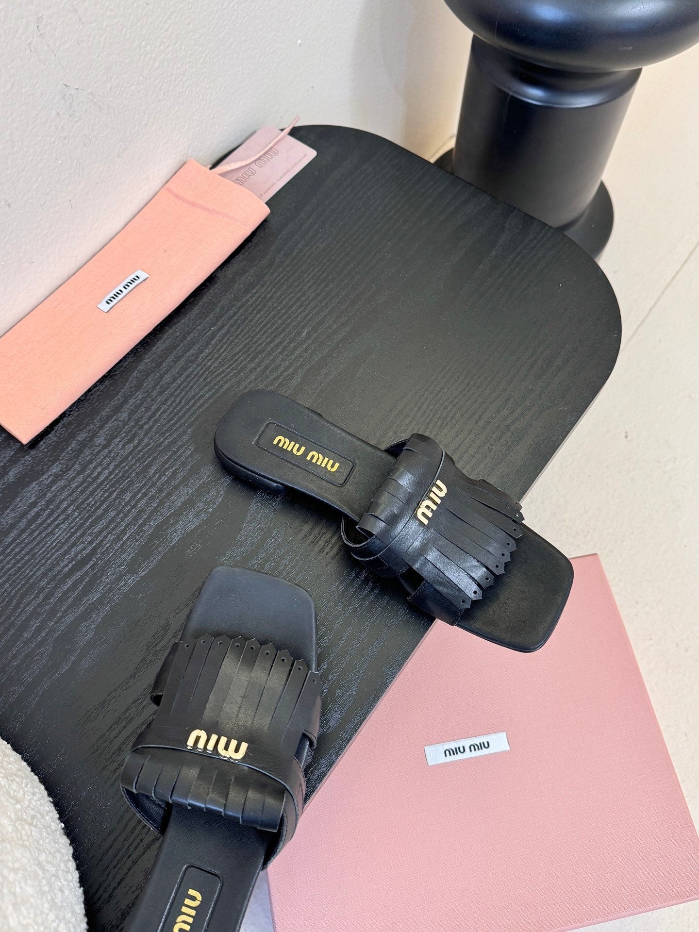 MIUMIU 26S FLAT SLIPPERS IN BLACK CALFSKIN