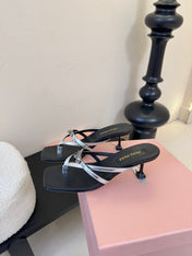 MIUMIU 26S LOW-HEEL THONG SANDALS IN BLACK AND SILVER CALFSKIN