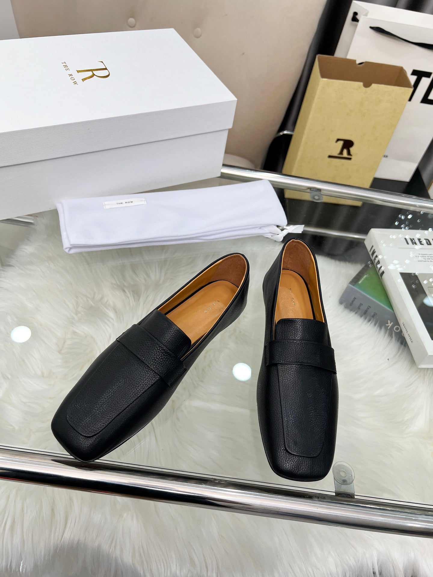 THE ROW 26S PENNY LOAFER FLATS IN BLACK GRAINED CALFSKIN
