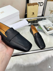 THE ROW 26S PENNY LOAFER FLATS IN BLACK GRAINED CALFSKIN