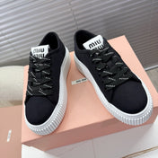 MIUMIU 26S PLATFORM SNEAKERS IN BLACK CANVAS