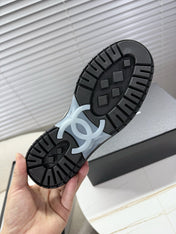 CHANEL 25S SNEAKERS WITH FUR ACCENTS 35MM IN BLACK CALFSKIN