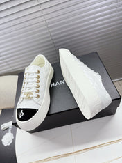 CHANEL 25S TRAINERS WHITE AND BLACK 35MM IN CALFSKIN