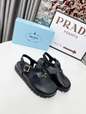 PRADA 26S RUBBER LOGO CHUNKY SOLE FISHERMAN SANDALS IN BLACK CALFSKIN