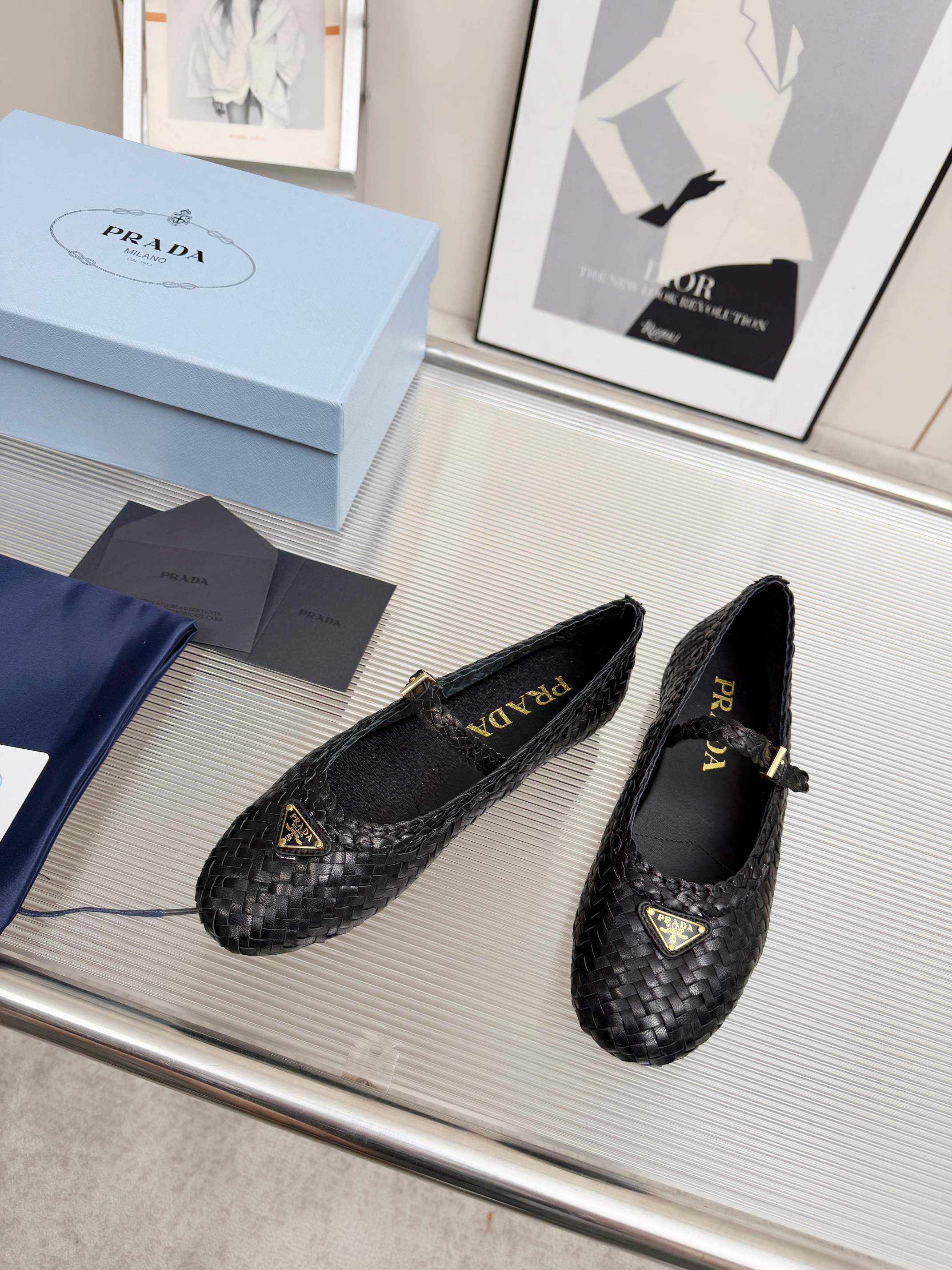 PRADA 26S MARY JANE FLATS IN BLACK WOVEN CALFSKIN
