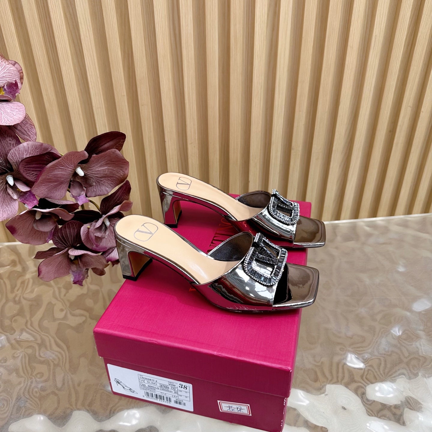 VALENTINO 25S HIGH-HEEL MULES 60 MM IN METALLIC SILVER PATENT CALFSKIN WITH CRYSTAL-EMBELLISHED STRAP