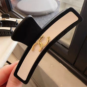 CHANEL 26S BARRETTE HAIR CLIP IN BLACK AND IVORY LEATHER 505339