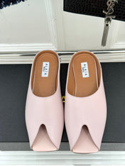 ALAIA FLAT MULE IN LIGHT PINK LAMBSKIN