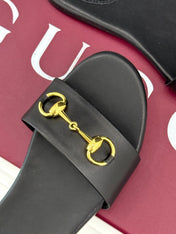 SLIDE SANDALS IN BLACK CALFSKIN WITH GOLD HARDWARE