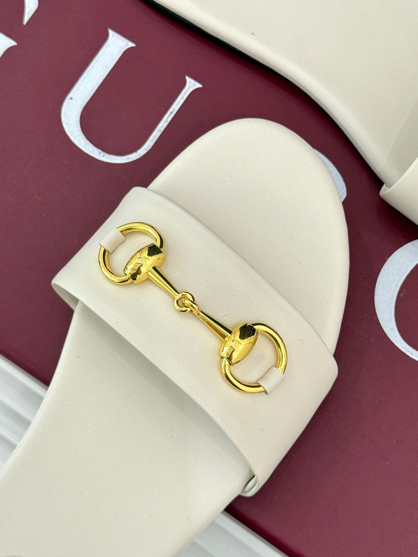 SLIDE SANDALS IN WHITE CALFSKIN WITH GOLD HARDWARE