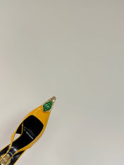GREEN GEM-STUDDED SLINGBACK PUMPS IN YELLOW PATENT CALFSKIN