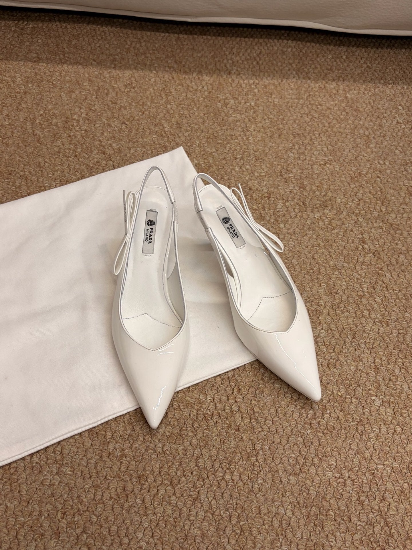 PRADA 26S SLINGBACK PUMPS IN WHITE PATENT CALFSKIN
