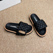 CHANEL 26S SLIDE SANDALS IN BLACK QUILTED CALFSKIN WITH LOGO PLAQUE