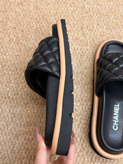 CHANEL 26S SLIDE SANDALS IN BLACK QUILTED CALFSKIN WITH LOGO PLAQUE