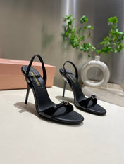 TWO STRAP HIGH HEELED SANDALS IN BLACK GLOSSY SHEEPSKIN