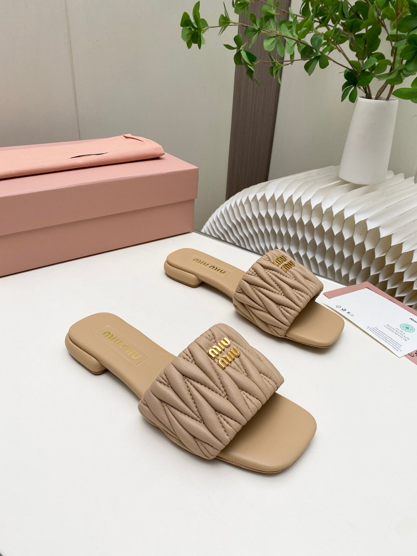MIUMIU 26S MATELASSE SLIDES IN BEIGE CALFSKIN